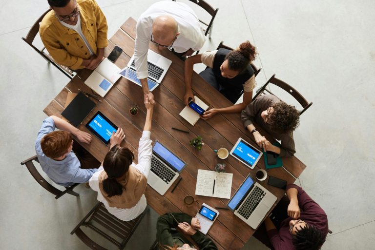 Top view of professionals working on Fashion SEO strategies